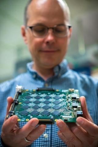 Rich Uhlig, managing director of Intel Labs, holds one of Intel